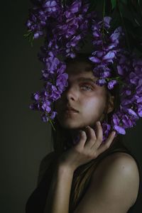 Portrait of beautiful woman against purple flowering plants
