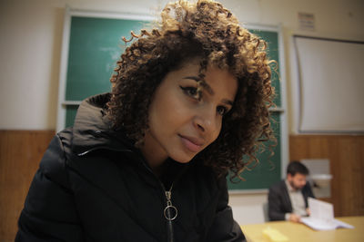 Portrait of young woman looking away