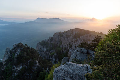 Scenic view of mountains against sky during sunset