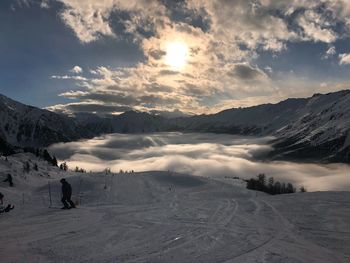 Scenic view of snow covered mountains against sky