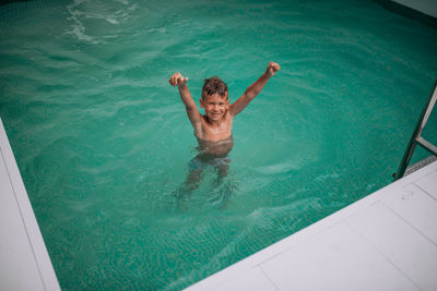 High angle view of boy in swimming pool