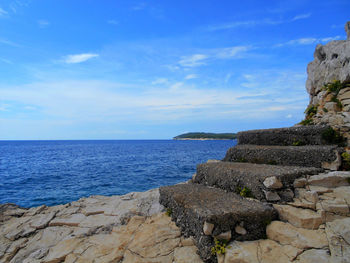 Scenic view of sea against blue sky