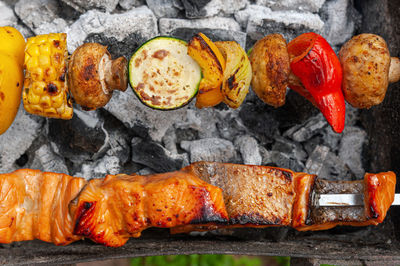 Close-up of meat on barbecue grill