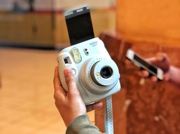 Close-up of person photographing