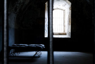 Empty chair in abandoned room