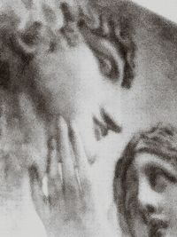 Close-up portrait of woman with hands