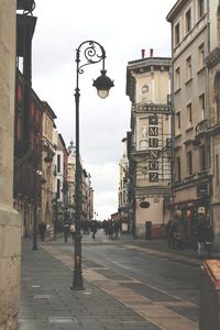 Street amidst buildings in city against sky