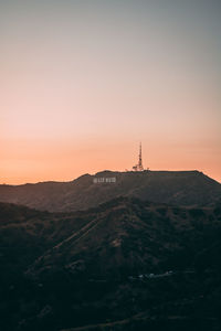 Scenic view of silhouette mountain against sky during sunset