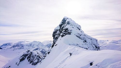 Snowcapped mountain peak in western norway 