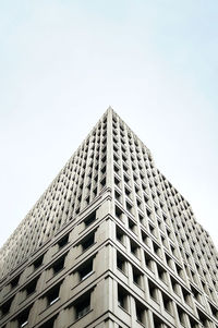 Low angle view of skyscraper against clear sky