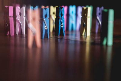 Close-up of multi colored clothespin on table