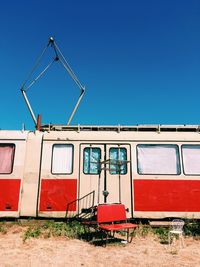 View of travel trailer against clear blue sky