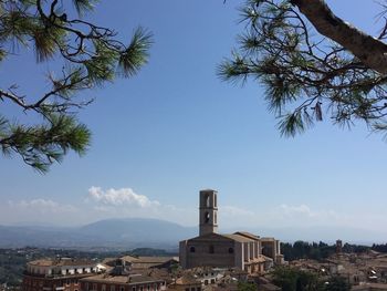 View of townscape against blue sky