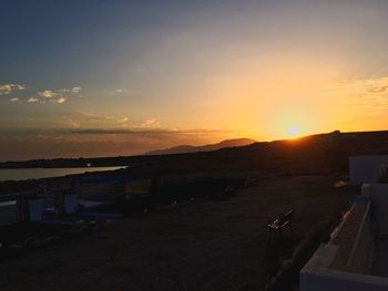 Scenic view of beach against sky during sunset