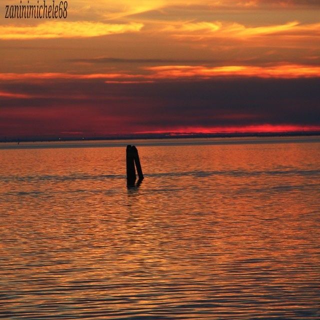 sunset, water, orange color, sky, sea, waterfront, scenics, tranquility, beauty in nature, tranquil scene, rippled, cloud - sky, horizon over water, idyllic, reflection, nature, silhouette, cloud, dramatic sky, outdoors