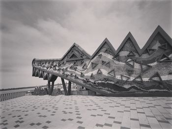 Low angle view of building against cloudy sky