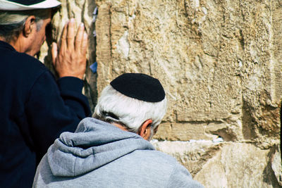 Rear view of man on wall