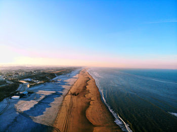 High angle view of land against clear sky at sunset