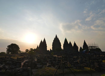 Panoramic view of buildings against sky during sunset