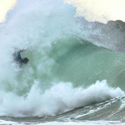 View of waves in sea against sky