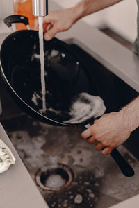 High angle view of man working in kitchen