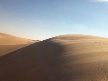 Scenic view of desert against clear sky