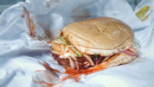 Close-up of burger on paper