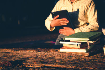 Man reading book on table