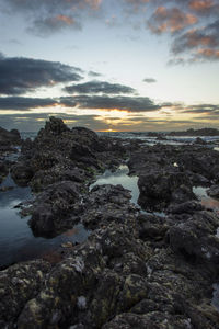 Scenic view of sea against cloudy sky