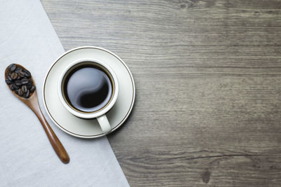 High angle view of coffee cup on table