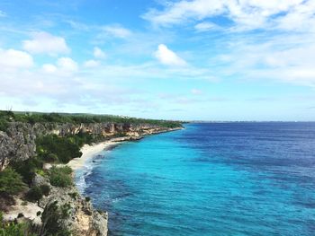 Scenic view of sea against cloudy sky