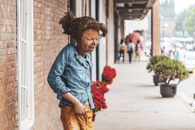 Young woman smiling outdoors in city