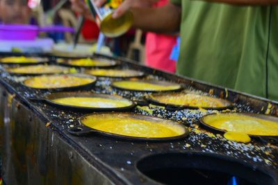 Close-up of man preparing food