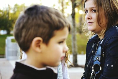 Mother looking at son at park