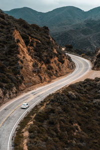 Aerial view of winding road on mountain