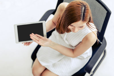 High angle view of woman using mobile phone