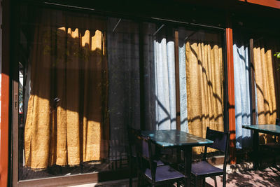 Clothes hanging on window at home