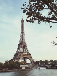 Low angle view of eiffel tower in city against sky