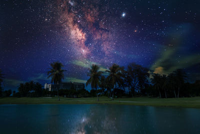 Scenic view of swimming pool against sky at night