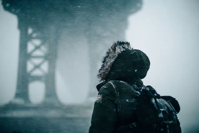 Rear view of person on wet during winter