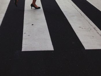 Woman walking on zebra crossing