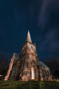 Low angle view of temple against sky at night