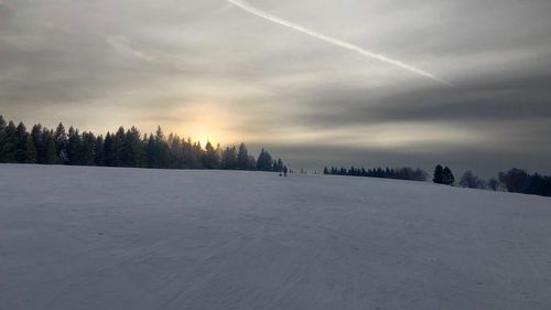 Scenic view of snow covered landscape against sky