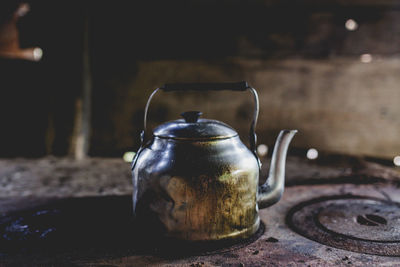 Close-up of old tea cup on table