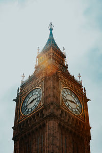 Low angle view of clock tower against sky