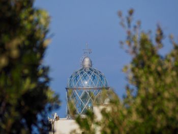 Low angle view of traditional building against clear blue sky