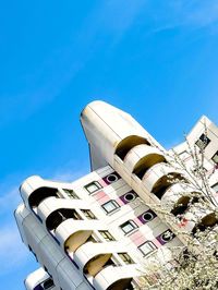 Low angle view of building against clear blue sky