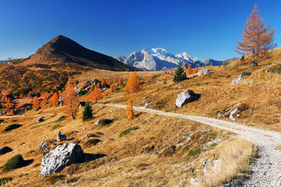 Scenic view of mountains against clear blue sky