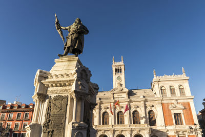 Low angle view of statue against sky