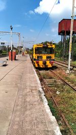 Train on railroad track against sky